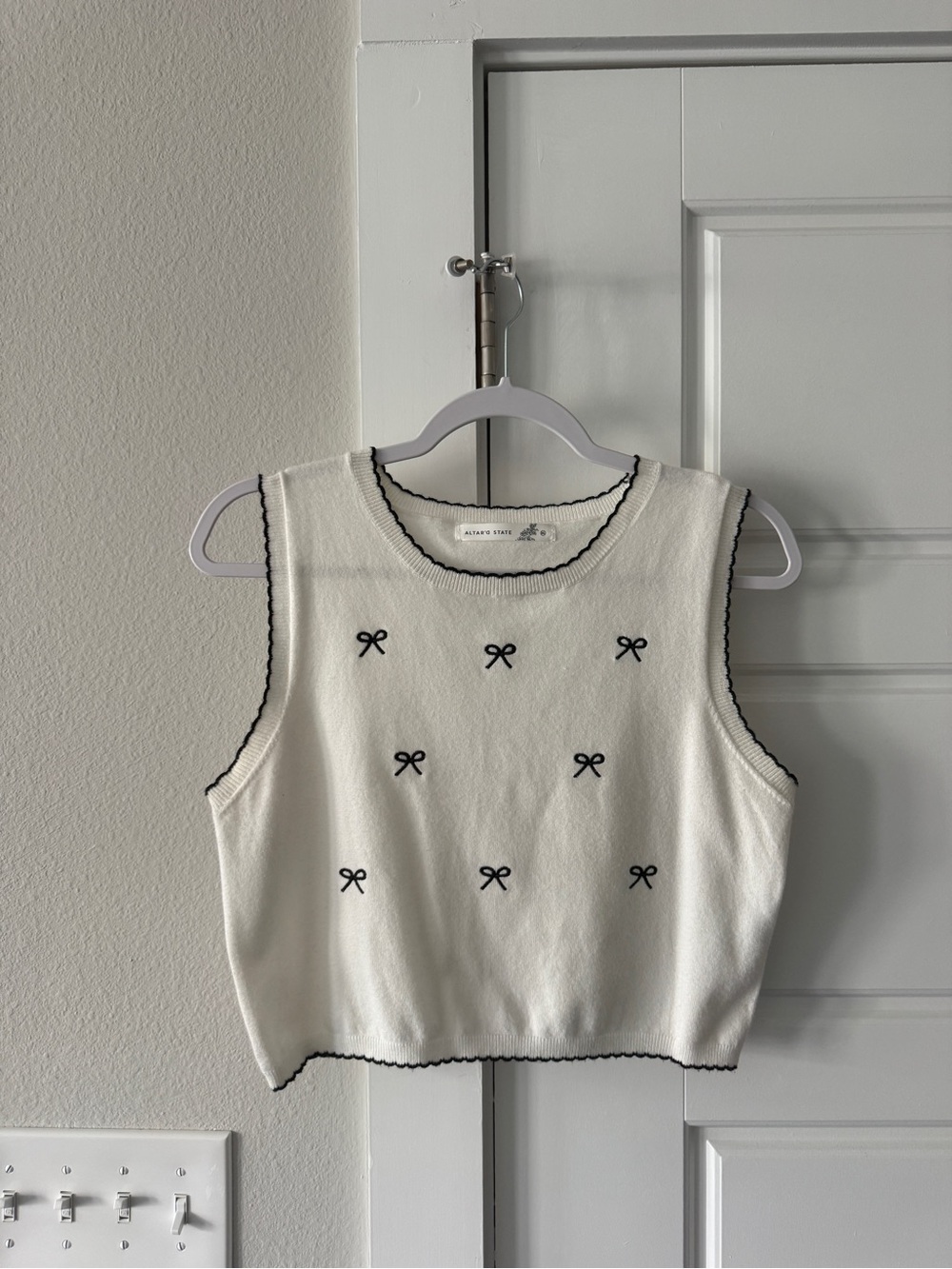 Altar'd State Cream Sleeveless Knit Tank with Black Bow Embroidery